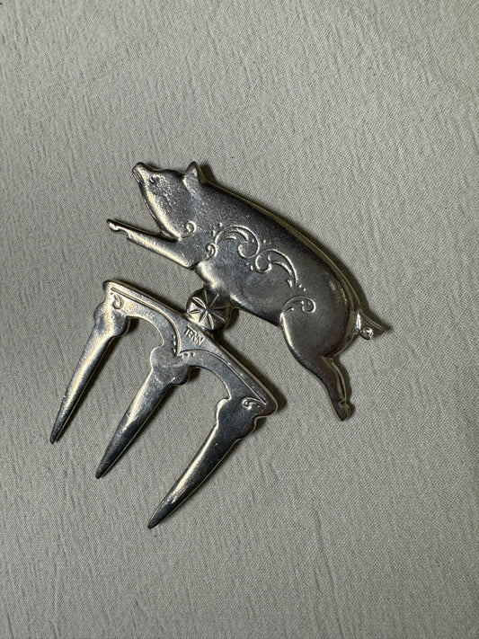 Skinkgaffel i tenn 1900-tal