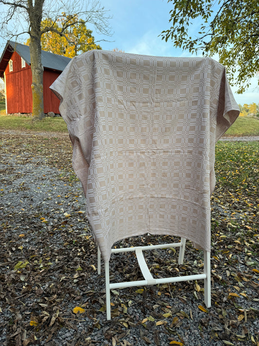 Beige mönstrad linneduk