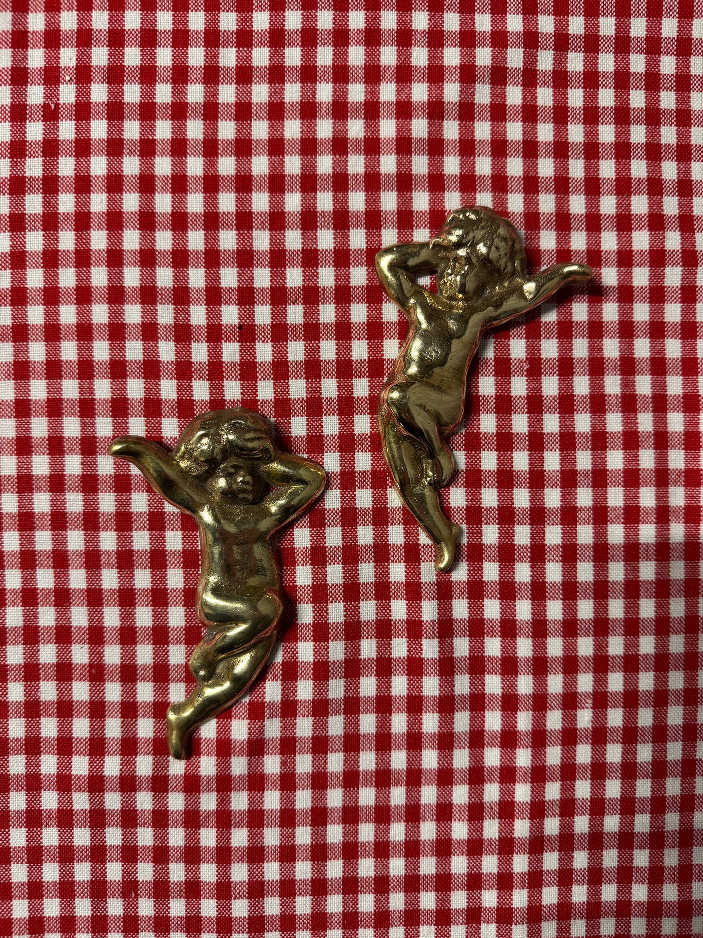 Änglar i mässing med lite tyngd