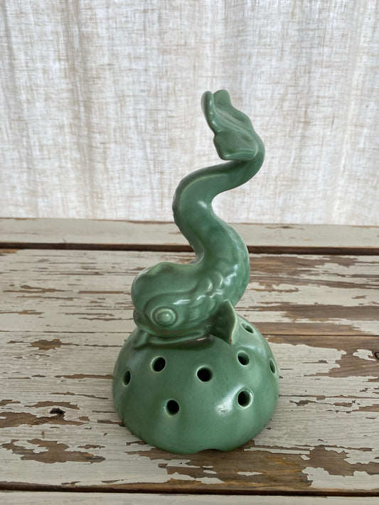 Blomsterfakir skulptur i grönt